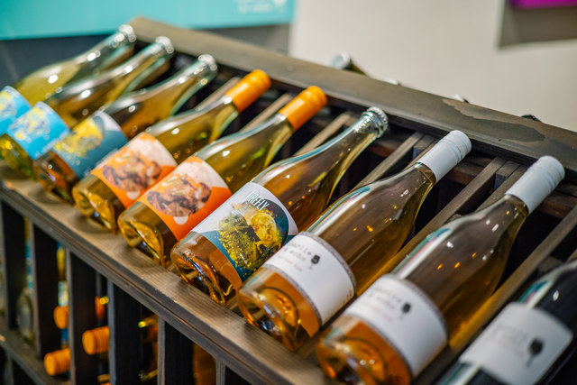 Wine bottles on display in rack