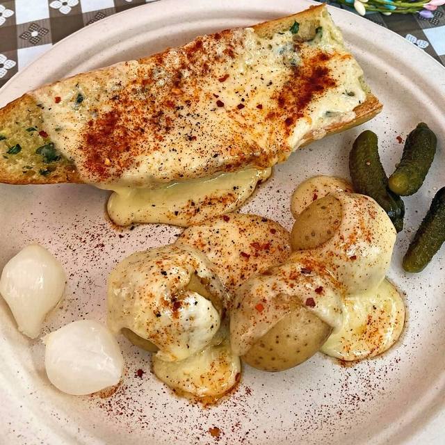 raclette on bread and potatoes